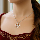 Sterling Silver Diamond Embellished Open Heart Pendant (.03 cttw)